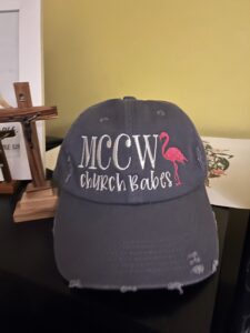 Baseball cap featuring MCCW Church Babes with pink flamingo