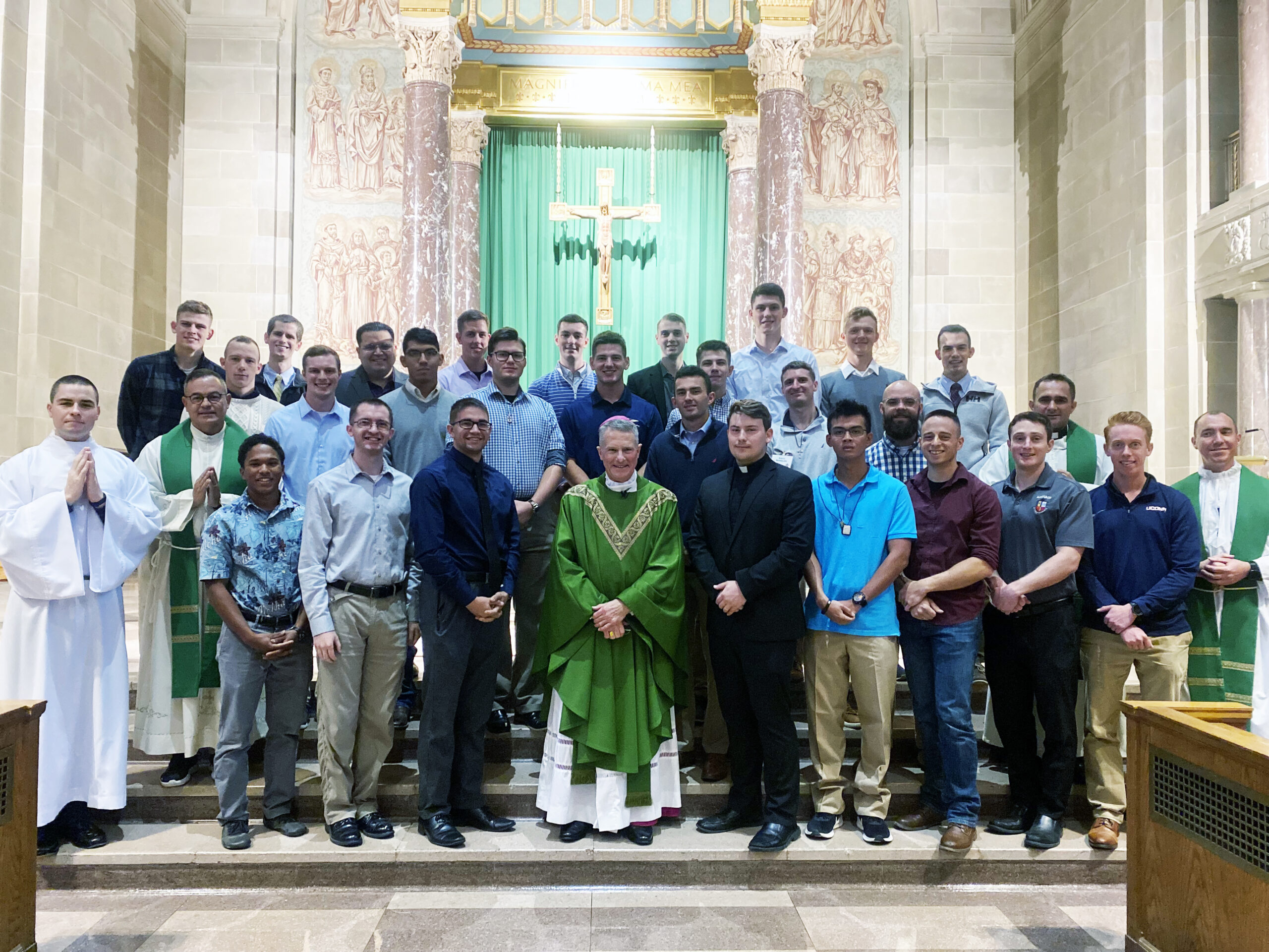 Image of Archbishop Broglio with discerning men at the Discernment Retreat in September 2022.