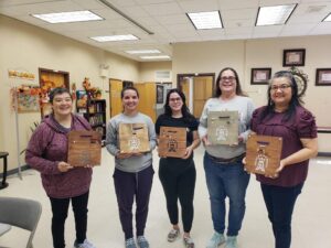 Ft. Bragg CWOC ladies holding their completed Kitchen Rosaries