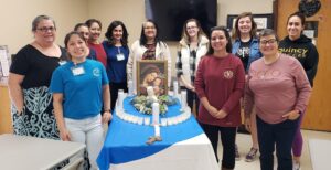 Ft. Bragg CWOC ladies around their Illuminated Rosary