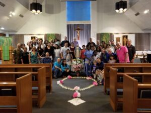 Kadena Air Force Base group image with CWOC and KoC members around an Illuminated Rosary