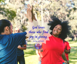 Women high-fiving with the quote by St. Pope John Paul II "God loves those who find joy in giving" with MCCW logo and connect, unite, inspire tagline at bottom